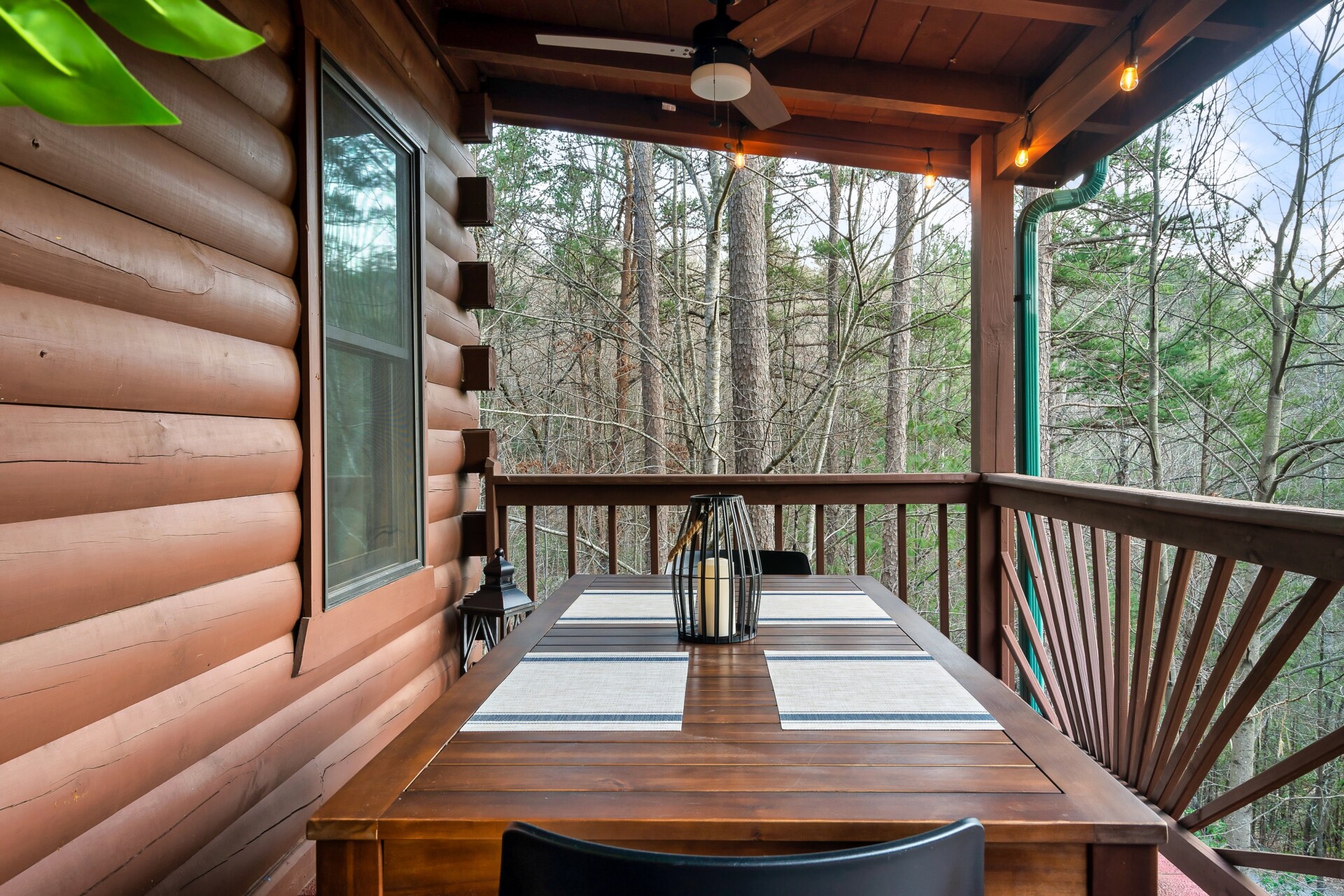 A dining table for 8 on the outside deck of the cabin