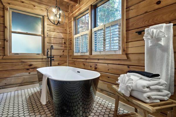 The master bathroom soaking tub is the perfect way to relax and unwind after a day out exploring the mountain trails, river activities and downtown Blue Ridge.
