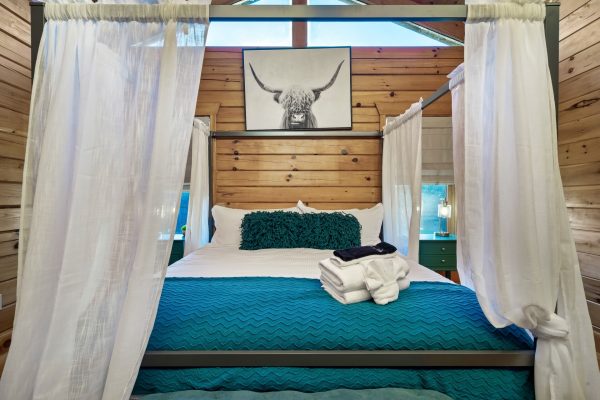 Rustic meets royalty in this king size canopy bed. Sweet dreams, y'all!